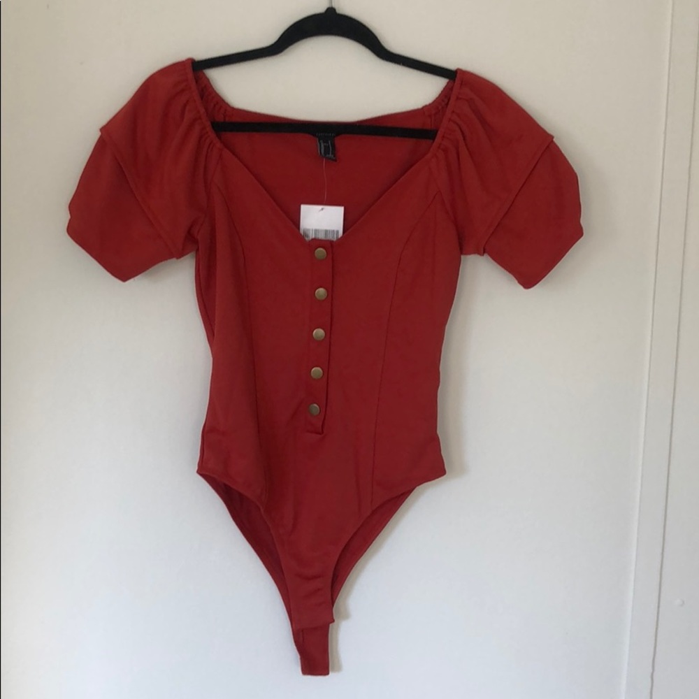 Burnt orange body suit